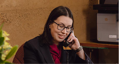 funeral arranger speaking on the phone