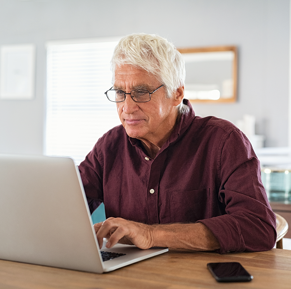 senior man working on a laptop