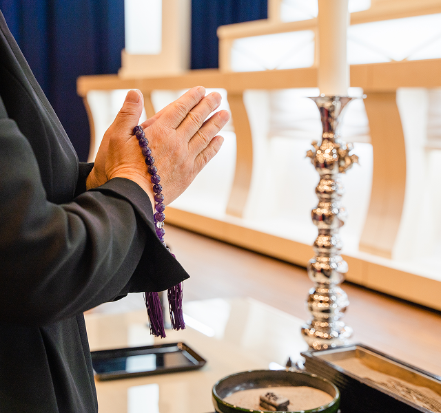 hands clasped in prayer